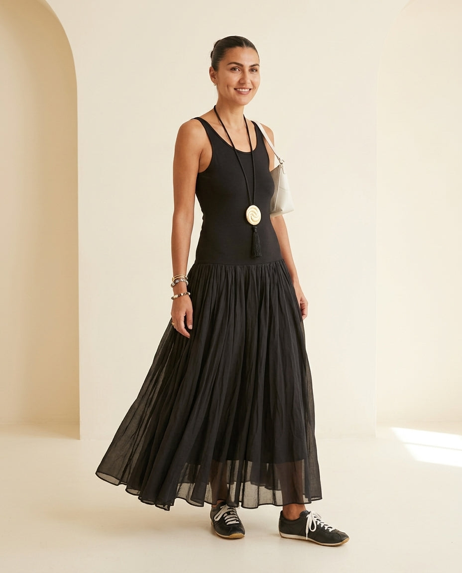 Black Charm Summer Textured Maxi Dress Black Maxi Dress with Relaxed Fit silhouette and Ribbed Knit texture, front view product image for Garden Party, an estate dinner at golden hour, US East / Hamptons Elite by Mesadic