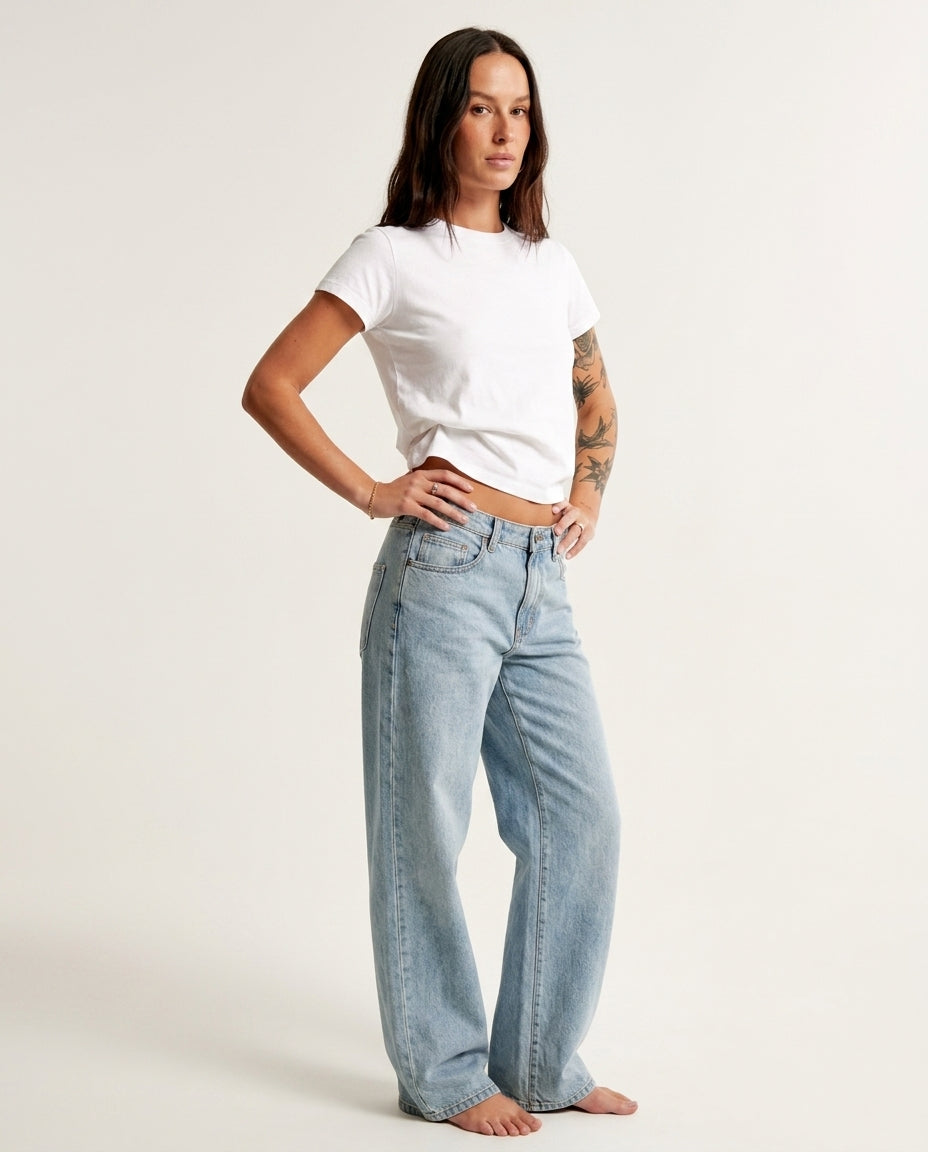 Light Wash Denim Bloom Summer Lace Romper Light Wash Denim Romper with Wide-Leg silhouette and Textured texture, clean studio product view for Wedding Guest, an estate dinner at golden hour, US East / Hamptons Elite by Mesadic