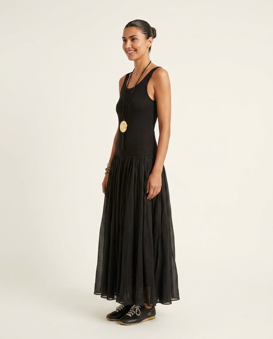 Black Charm Summer Textured Maxi Dress Black Maxi Dress with Relaxed Fit silhouette and Ribbed Knit texture, clean studio product view for Garden Party, an estate dinner at golden hour, US East / Hamptons Elite by Mesadic