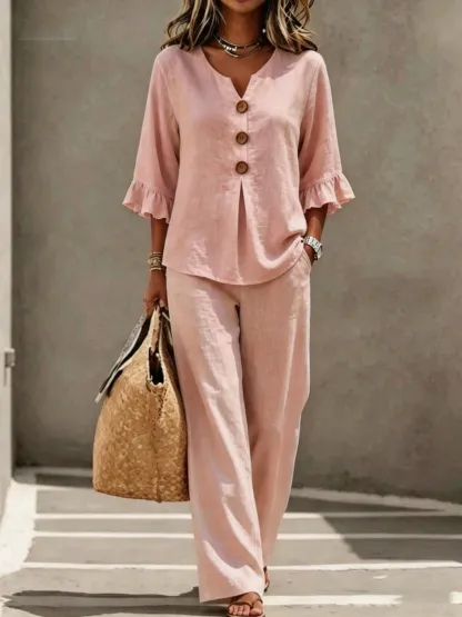 A women's set consisting of a ruffled sleeve top and wide-leg trousers.