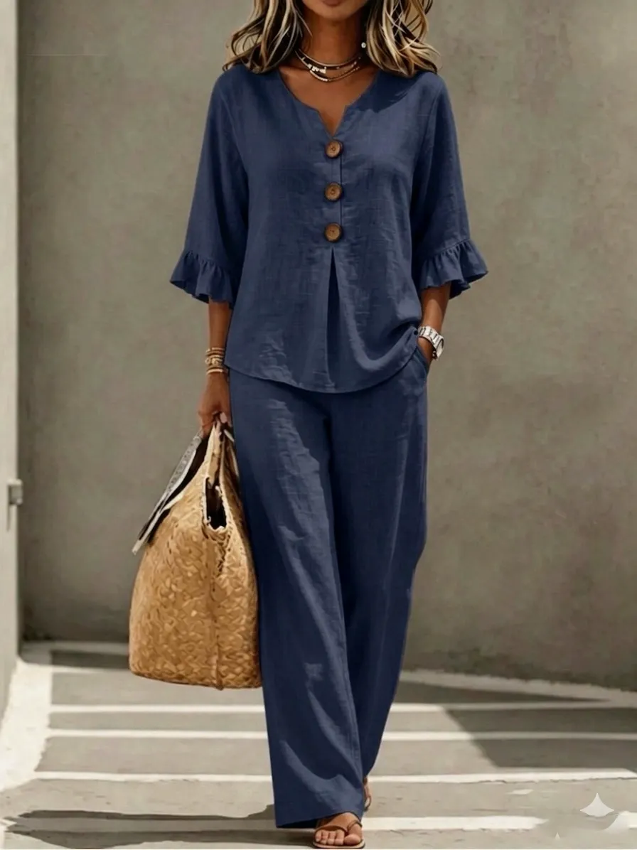A women's set consisting of a ruffled sleeve top and wide-leg trousers.