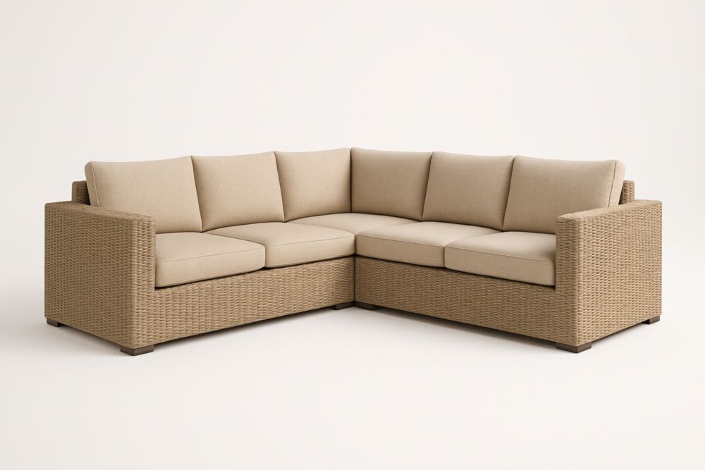 Divano angolare in resina intrecciata con cuscini in tessuto beige