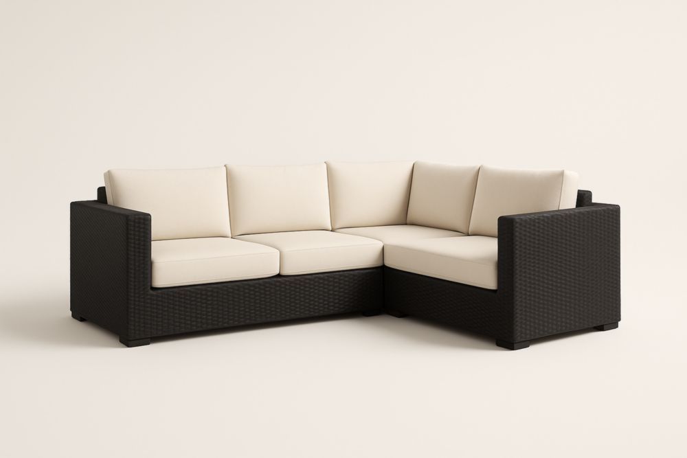 Divano angolare in rattan sintetico nero con cuscini in poliestere crema