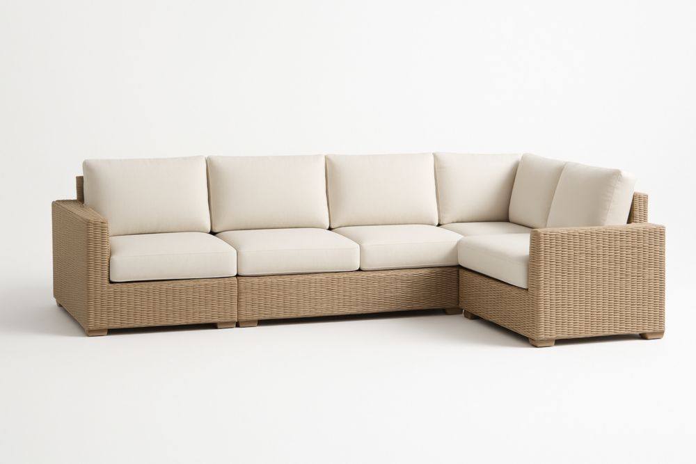 Divano angolare modulare in vimini con cuscini in tessuto crema
