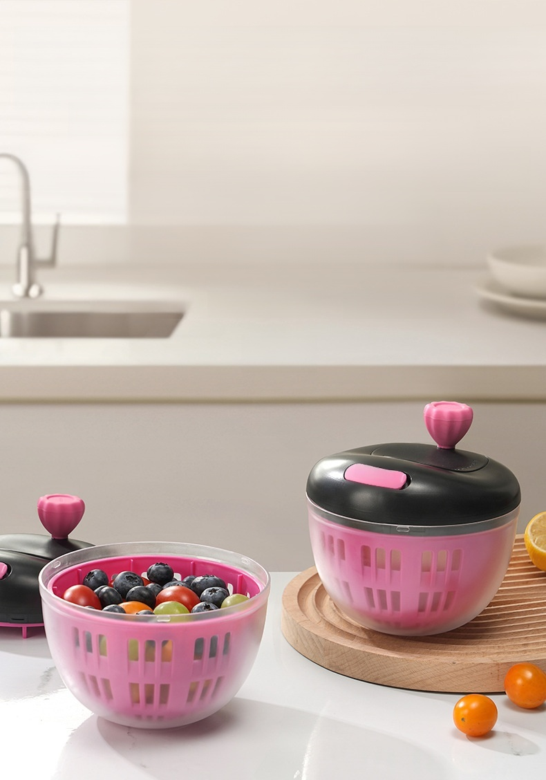 Manual vegetable drainer in use for rinsing lettuce