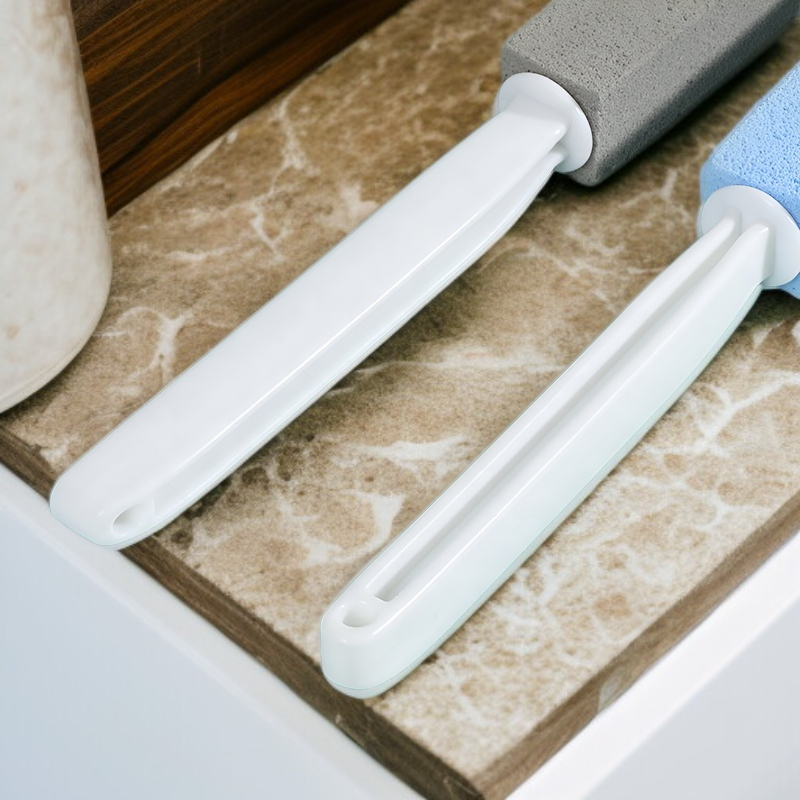 Removing hard water stains with pumice toilet brush