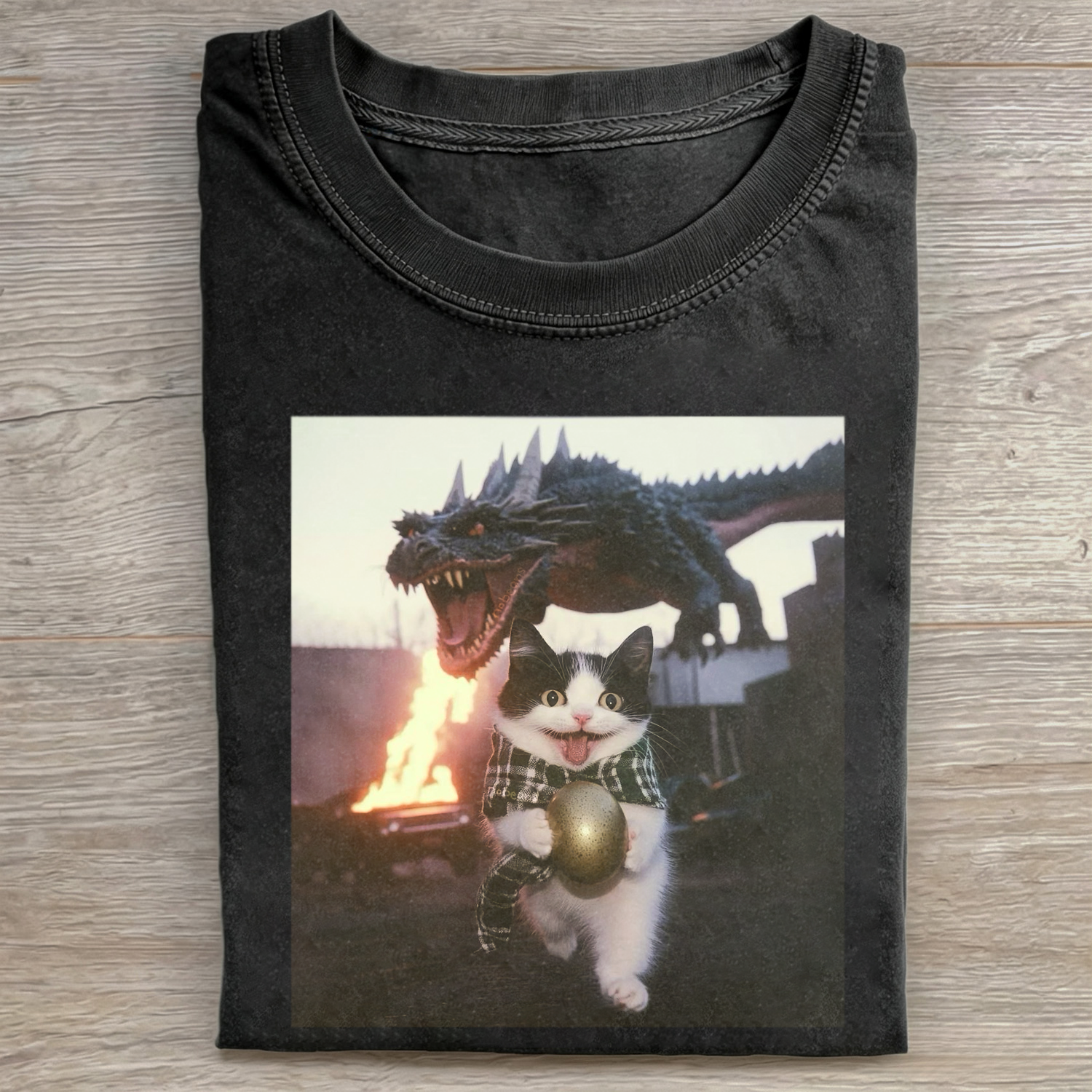 Cat Holding Dinosaur Egg T-shirt