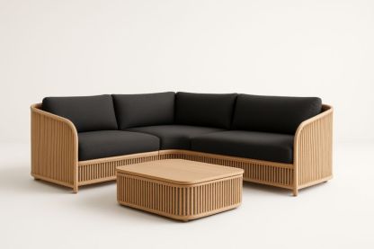 Divano angolare in tessuto nero con struttura in rattan e tavolino