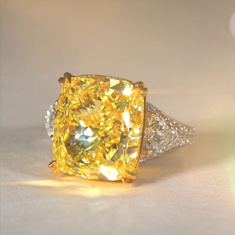 17.0 Carat Cushion Cut Yellow Diamond Ring With Two Hearts Side Stones