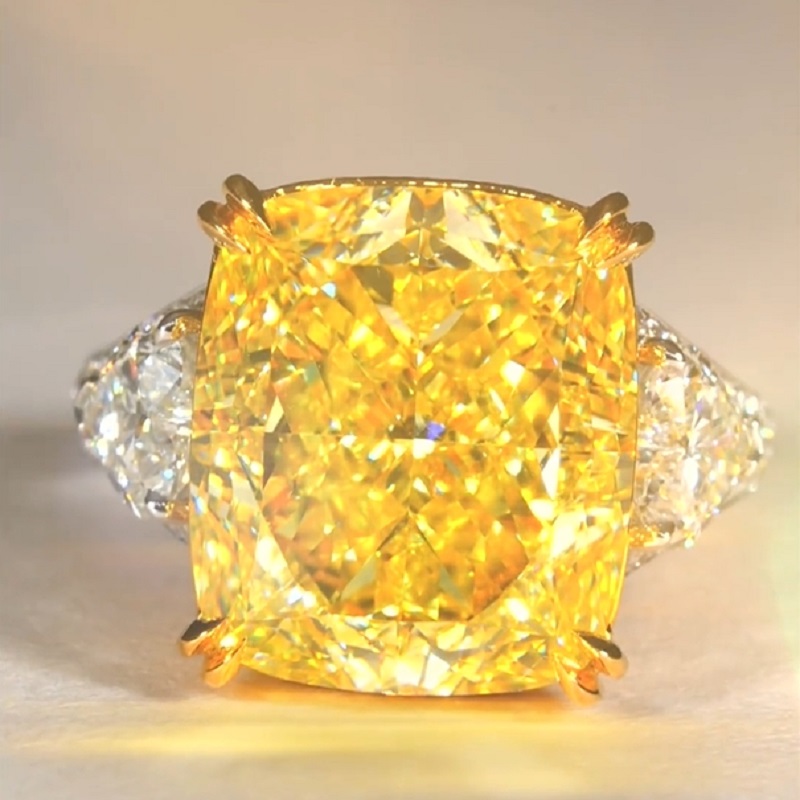 17.0 Carat Cushion Cut Yellow Diamond Ring With Two Hearts Side Stones