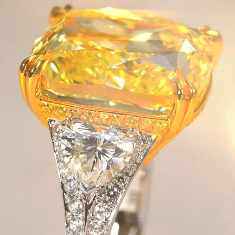 17.0 Carat Cushion Cut Yellow Diamond Ring With Two Hearts Side Stones