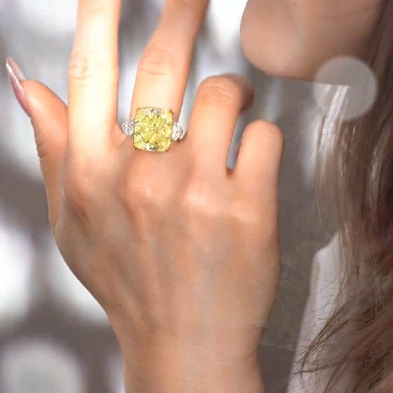 17.0 Carat Cushion Cut Yellow Diamond Ring With Two Hearts Side Stones