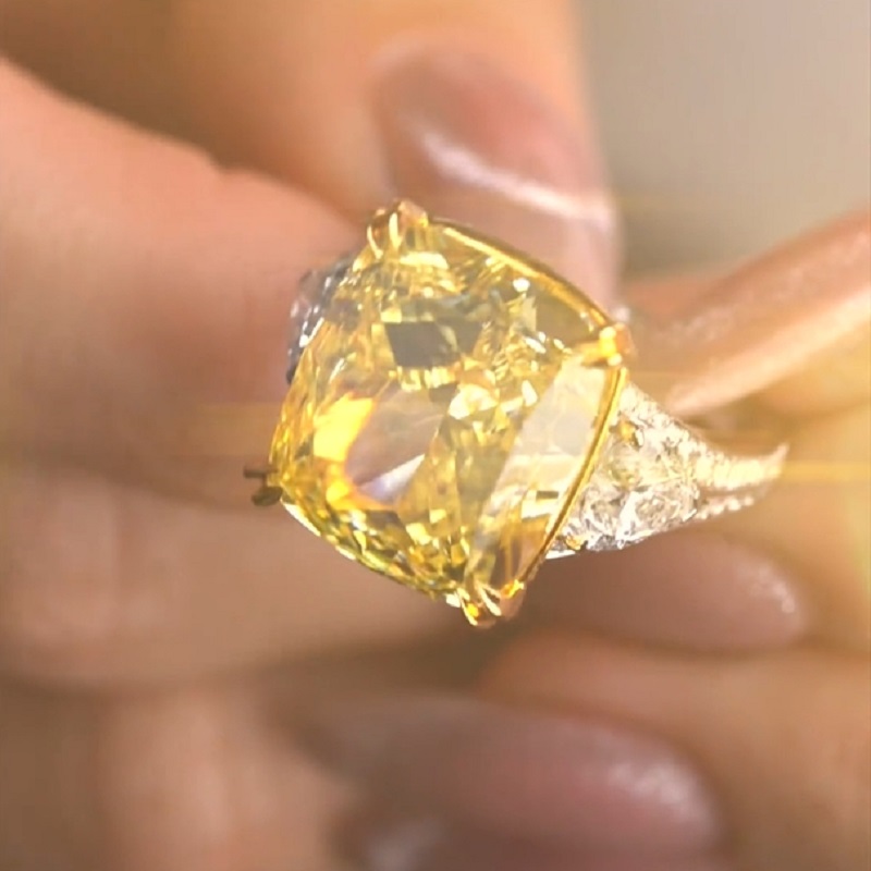 17.0 Carat Cushion Cut Yellow Diamond Ring With Two Hearts Side Stones