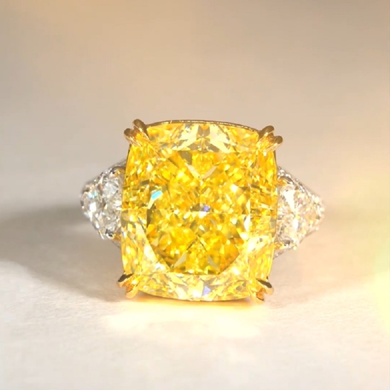 17.0 Carat Cushion Cut Yellow Diamond Ring With Two Hearts Side Stones