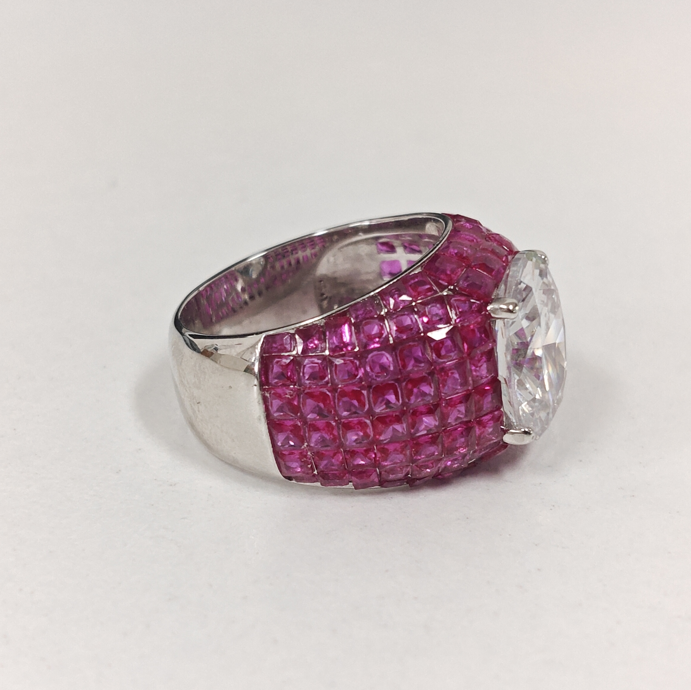 3ct Oval Cut Cocktail Ring Nestled Seamlessly in Invisible Set Rubies