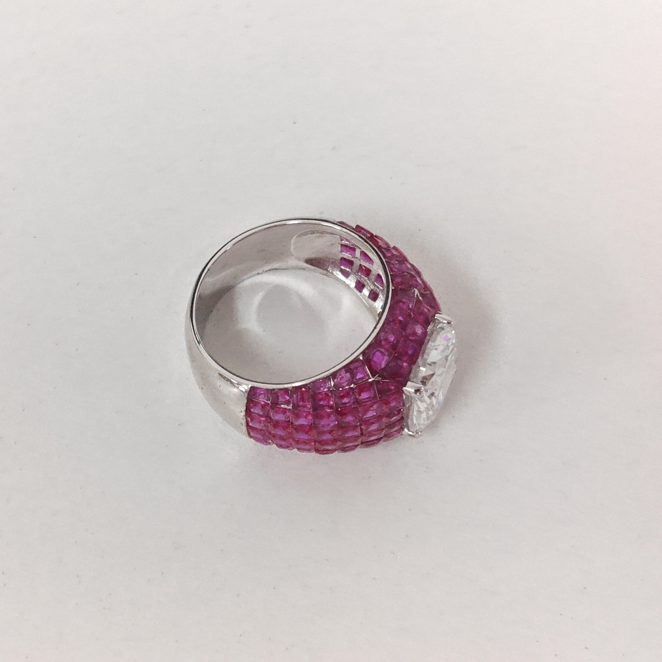3ct Oval Cut Cocktail Ring Nestled Seamlessly in Invisible Set Rubies