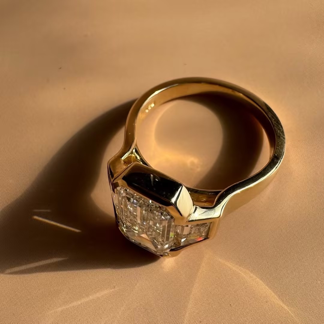 Contemporary Three-stone Elongated Emerald Cut White Stone Ring