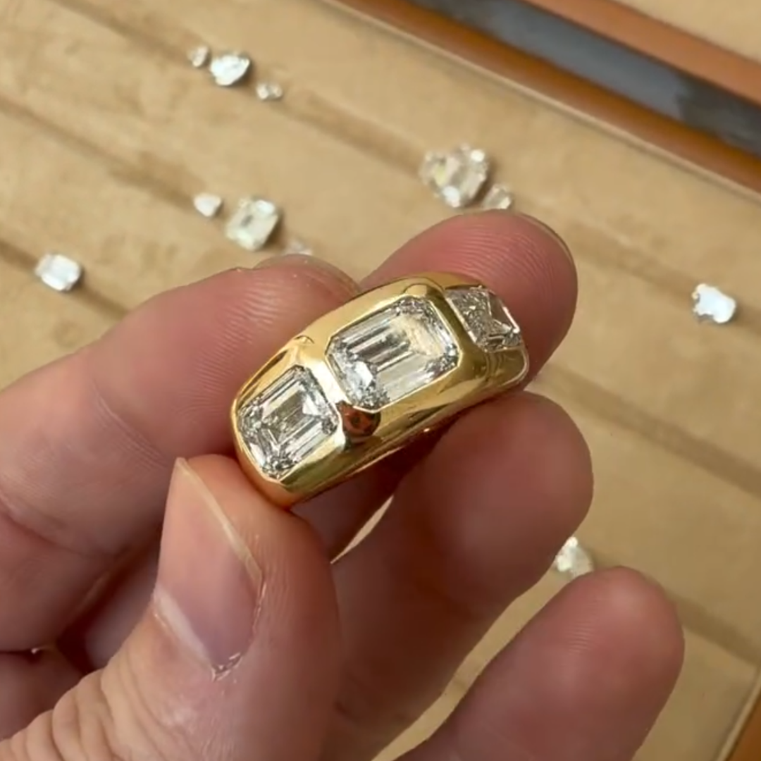 East-west Design Emerald Cut Three-stone Cigar Band Ring