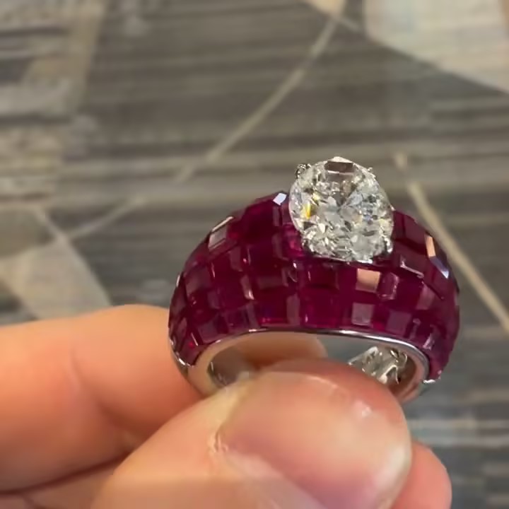 3ct Oval Cut Cocktail Ring Nestled Seamlessly in Invisible Set Rubies
