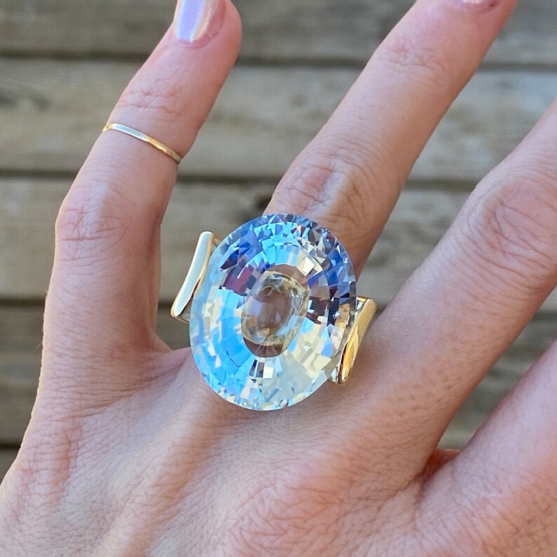 56.8 Carat Fine Quality Impressive Step Cut Oval Blue Topaz Ring