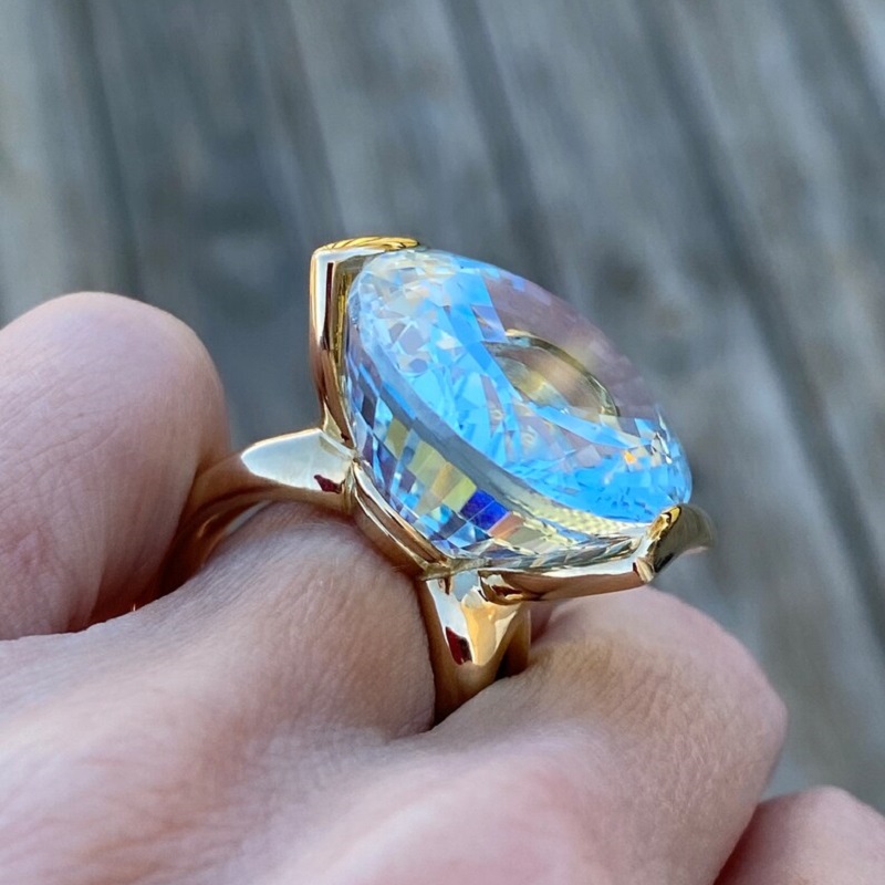 56.8 Carat Fine Quality Impressive Step Cut Oval Blue Topaz Ring