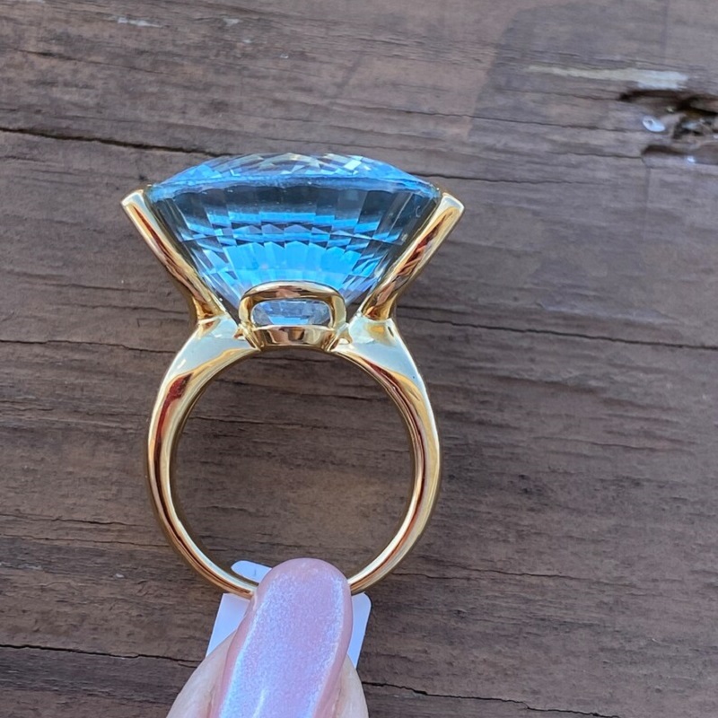 56.8 Carat Fine Quality Impressive Step Cut Oval Blue Topaz Ring