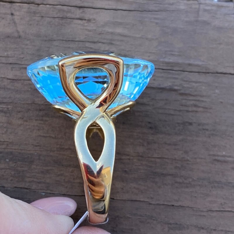 56.8 Carat Fine Quality Impressive Step Cut Oval Blue Topaz Ring