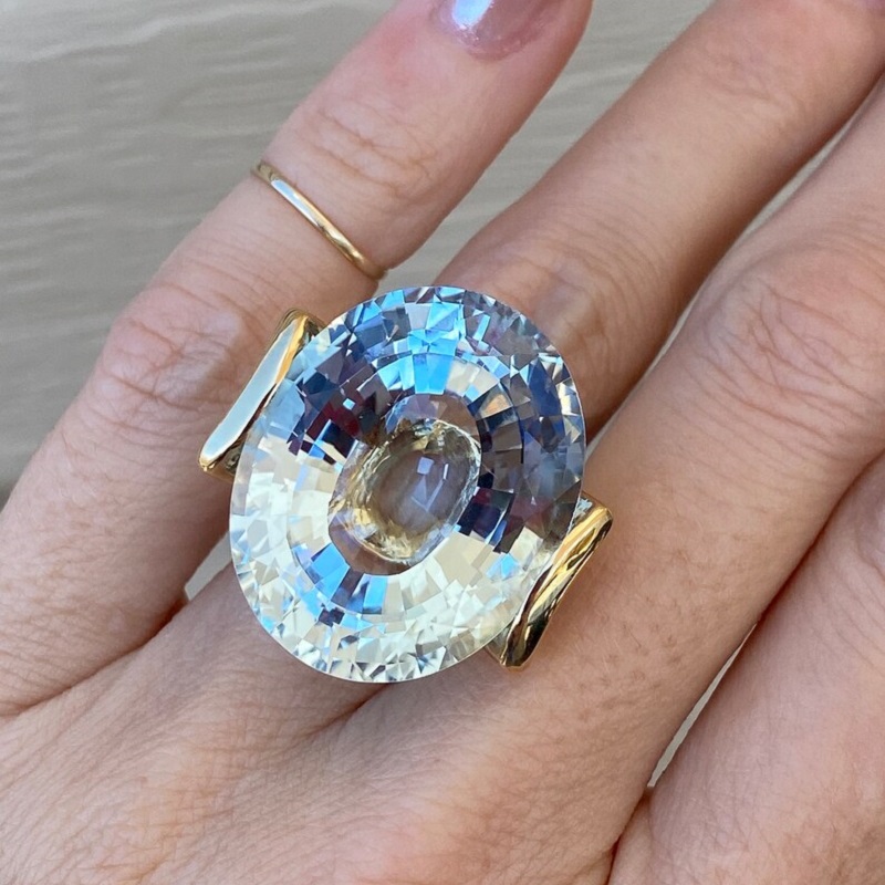 56.8 Carat Fine Quality Impressive Step Cut Oval Blue Topaz Ring