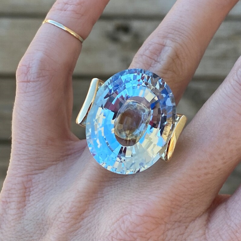 56.8 Carat Fine Quality Impressive Step Cut Oval Blue Topaz Ring