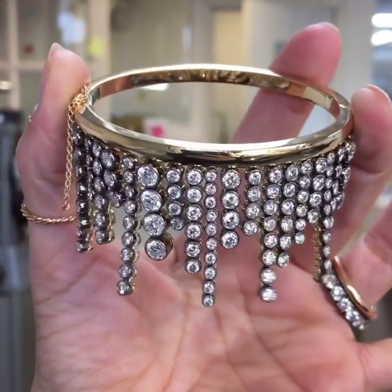 A Side Of Round Cut White Sapphires Yellow Gold Dangle Bangle