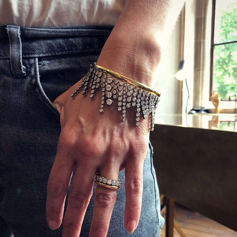 A Side Of Round Cut White Sapphires Yellow Gold Dangle Bangle
