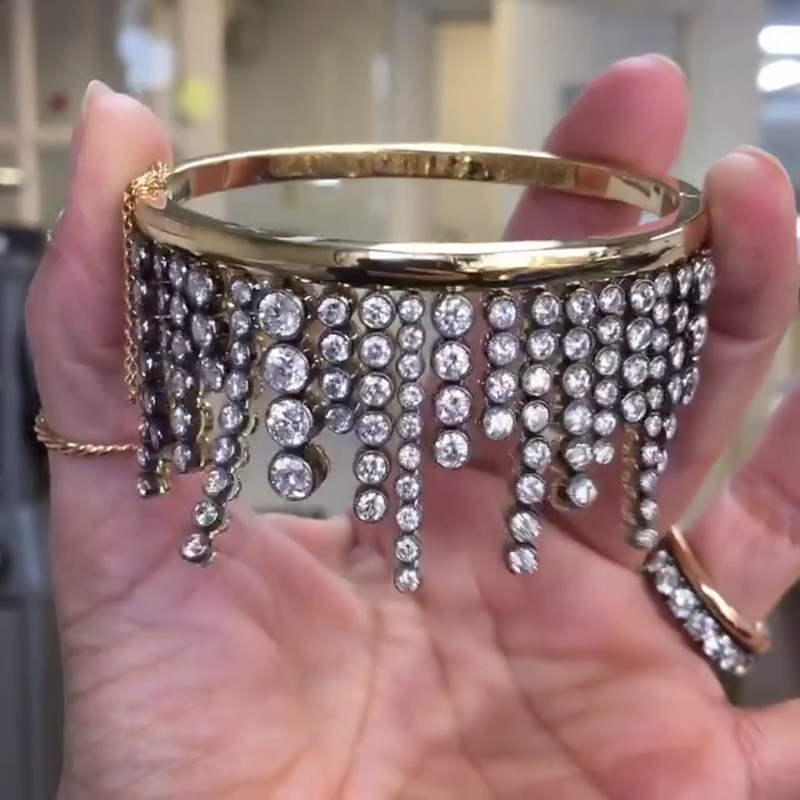 A Side Of Round Cut White Sapphires Yellow Gold Dangle Bangle