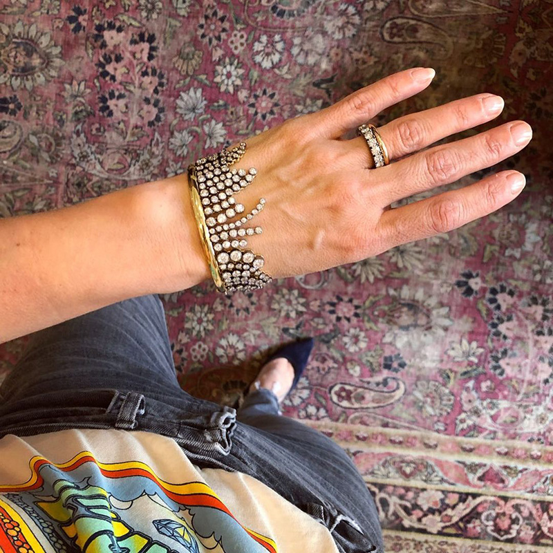 A Side Of Round Cut White Sapphires Yellow Gold Dangle Bangle