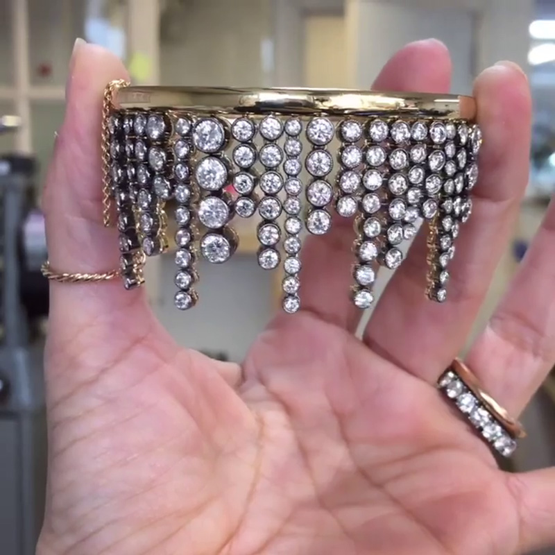 A Side Of Round Cut White Sapphires Yellow Gold Dangle Bangle