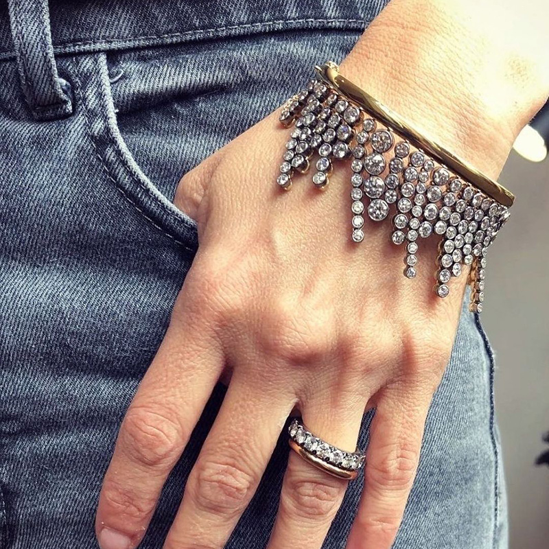 A Side Of Round Cut White Sapphires Yellow Gold Dangle Bangle