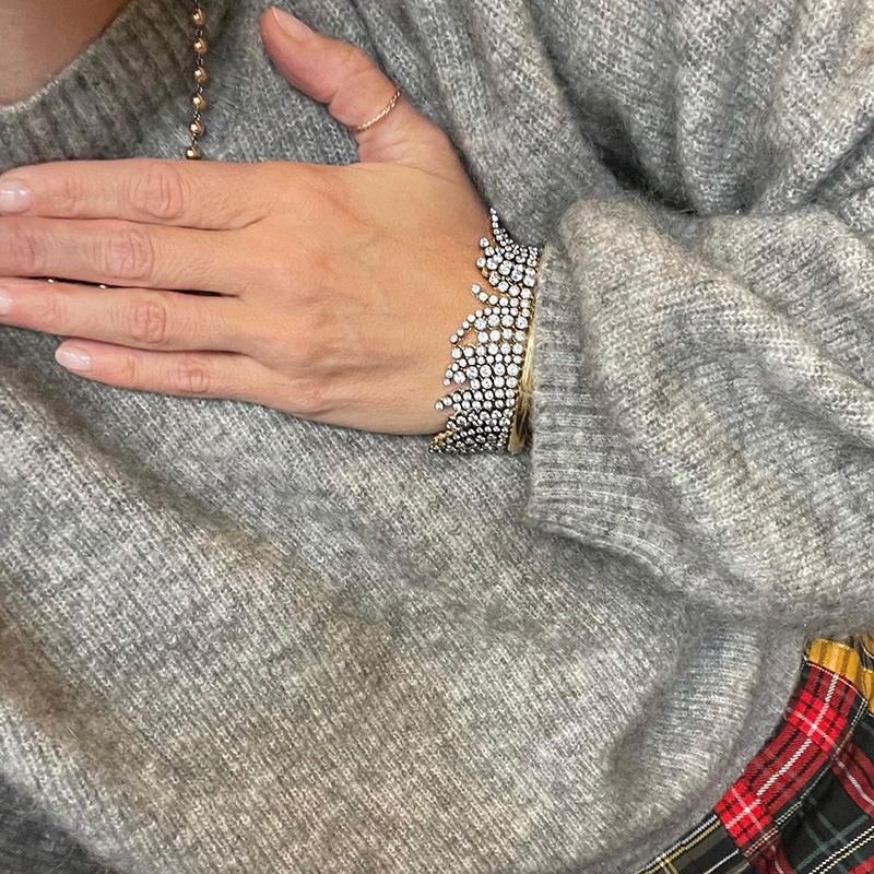 A Side Of Round Cut White Sapphires Yellow Gold Dangle Bangle