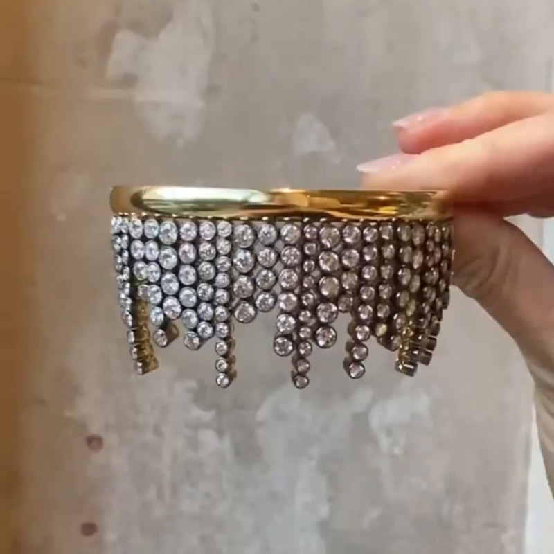 A Side Of Round Cut White Sapphires Yellow Gold Dangle Bangle