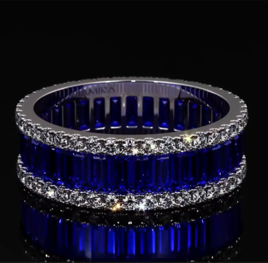 6.25ct Emerald Cut Blue Zircon Eternity Ring