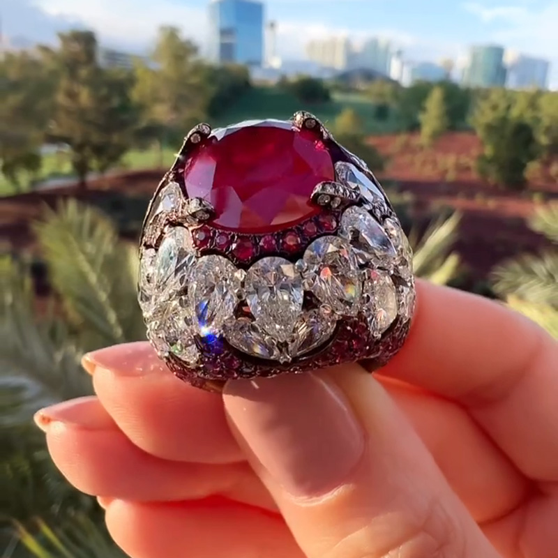 10ct Oval Cut Ruby With A Dome Of Pear Cut White Sapphires Paved Cocktail Ring