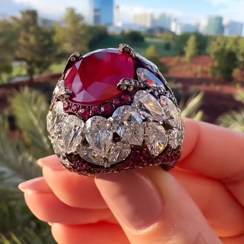 10ct Oval Cut Ruby With A Dome Of Pear Cut White Sapphires Paved Cocktail Ring
