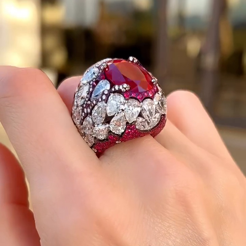 10ct Oval Cut Ruby With A Dome Of Pear Cut White Sapphires Paved Cocktail Ring