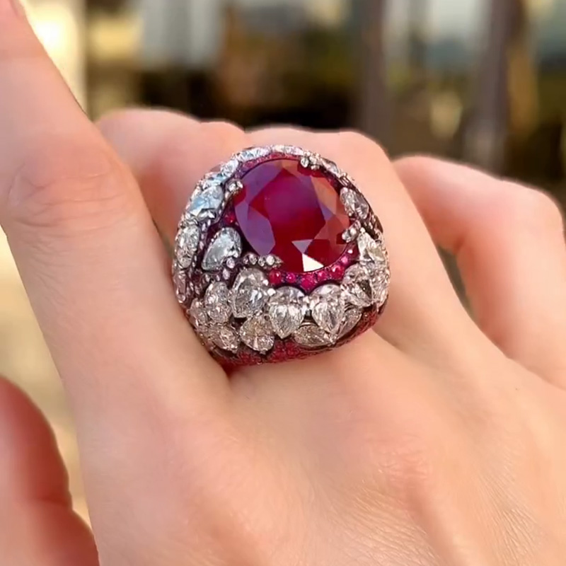 10ct Oval Cut Ruby With A Dome Of Pear Cut White Sapphires Paved Cocktail Ring
