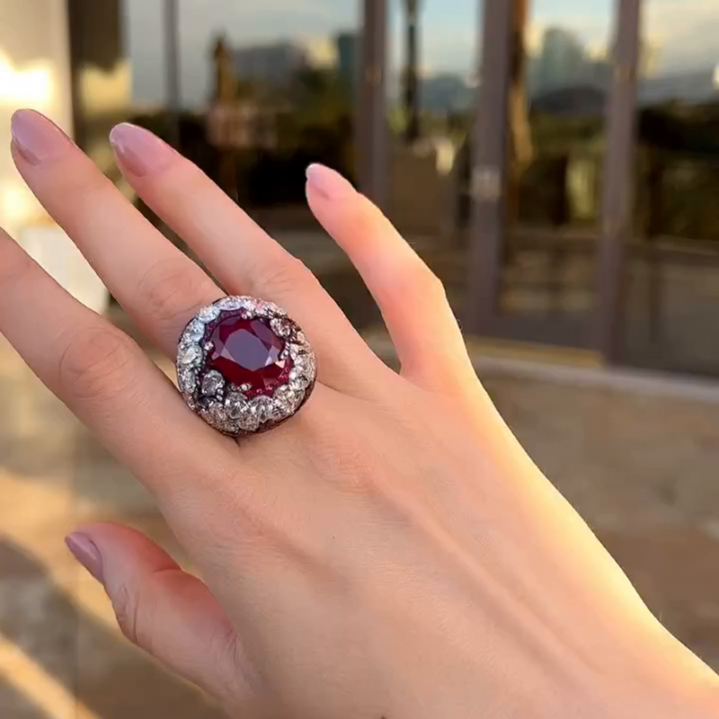 10ct Oval Cut Ruby With A Dome Of Pear Cut White Sapphires Paved Cocktail Ring