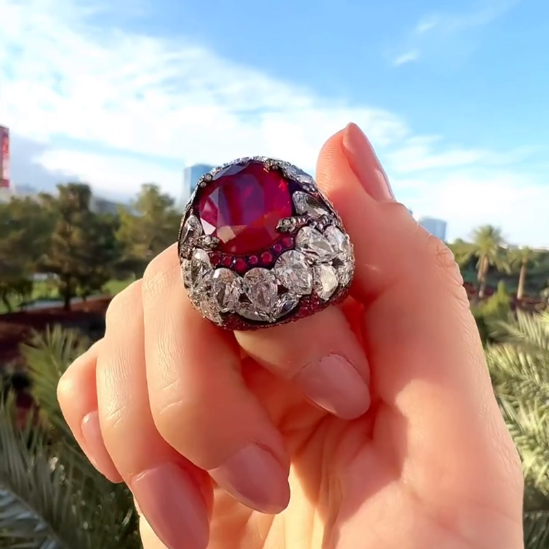 10ct Oval Cut Ruby With A Dome Of Pear Cut White Sapphires Paved Cocktail Ring