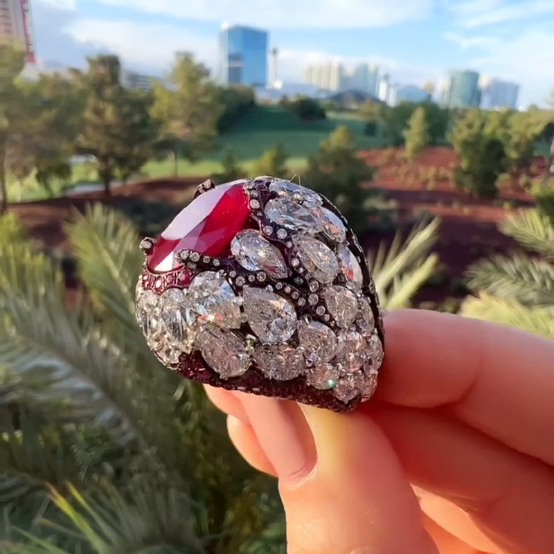 10ct Oval Cut Ruby With A Dome Of Pear Cut White Sapphires Paved Cocktail Ring
