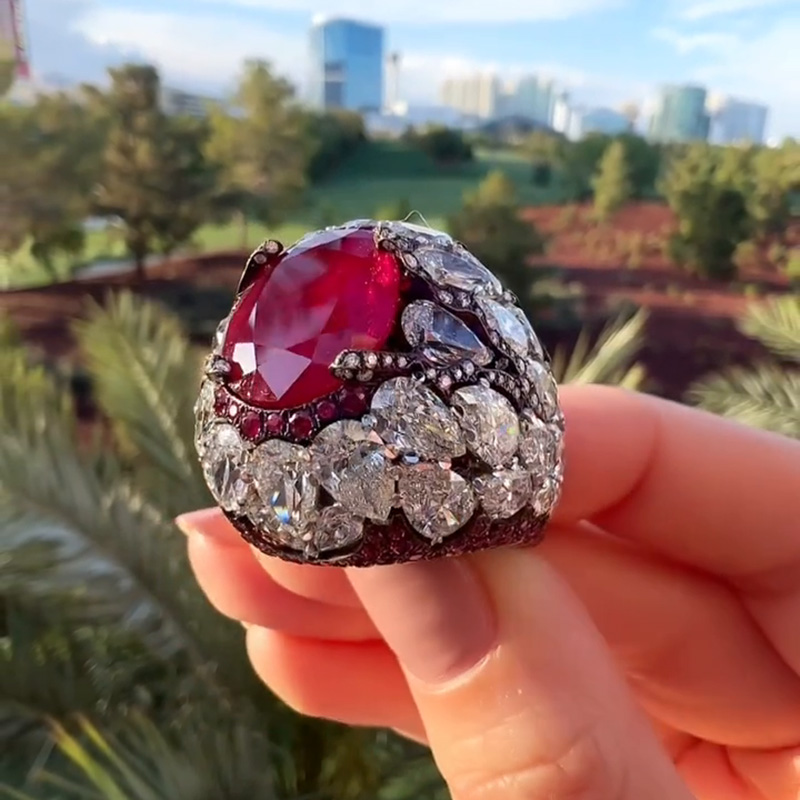 10ct Oval Cut Ruby With A Dome Of Pear Cut White Sapphires Paved Cocktail Ring