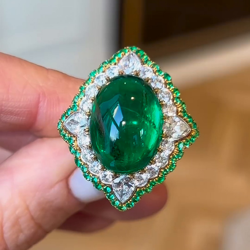 13.35ct Oval Cabochon Emerald Set Within A White Sapphire Surround Handmade Ring
