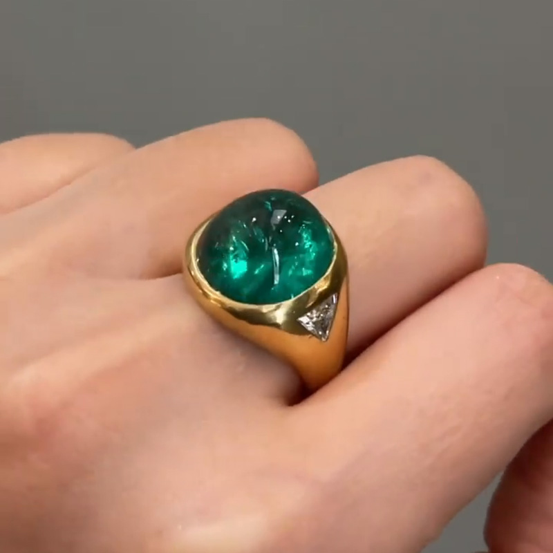 9.5ct Cabochon Emerald With with Triangular Cut White Sapphire Shoulders Yellow Gold Ring