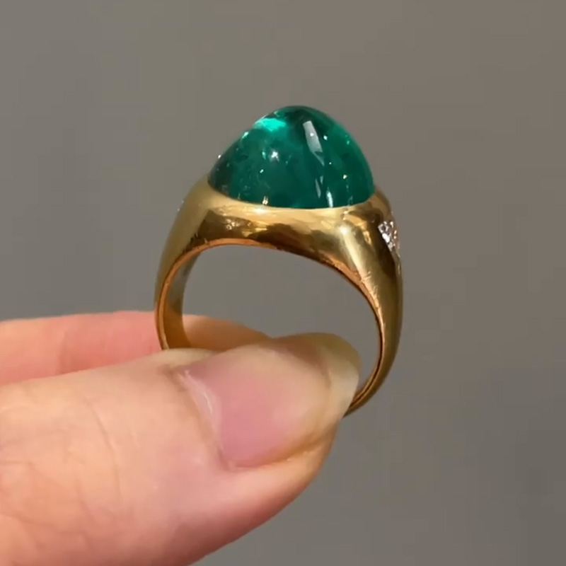 9.5ct Cabochon Emerald With with Triangular Cut White Sapphire Shoulders Yellow Gold Ring