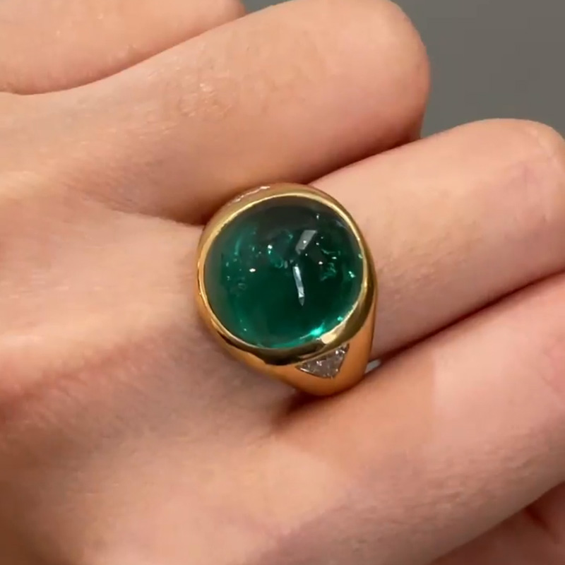 9.5ct Cabochon Emerald With with Triangular Cut White Sapphire Shoulders Yellow Gold Ring